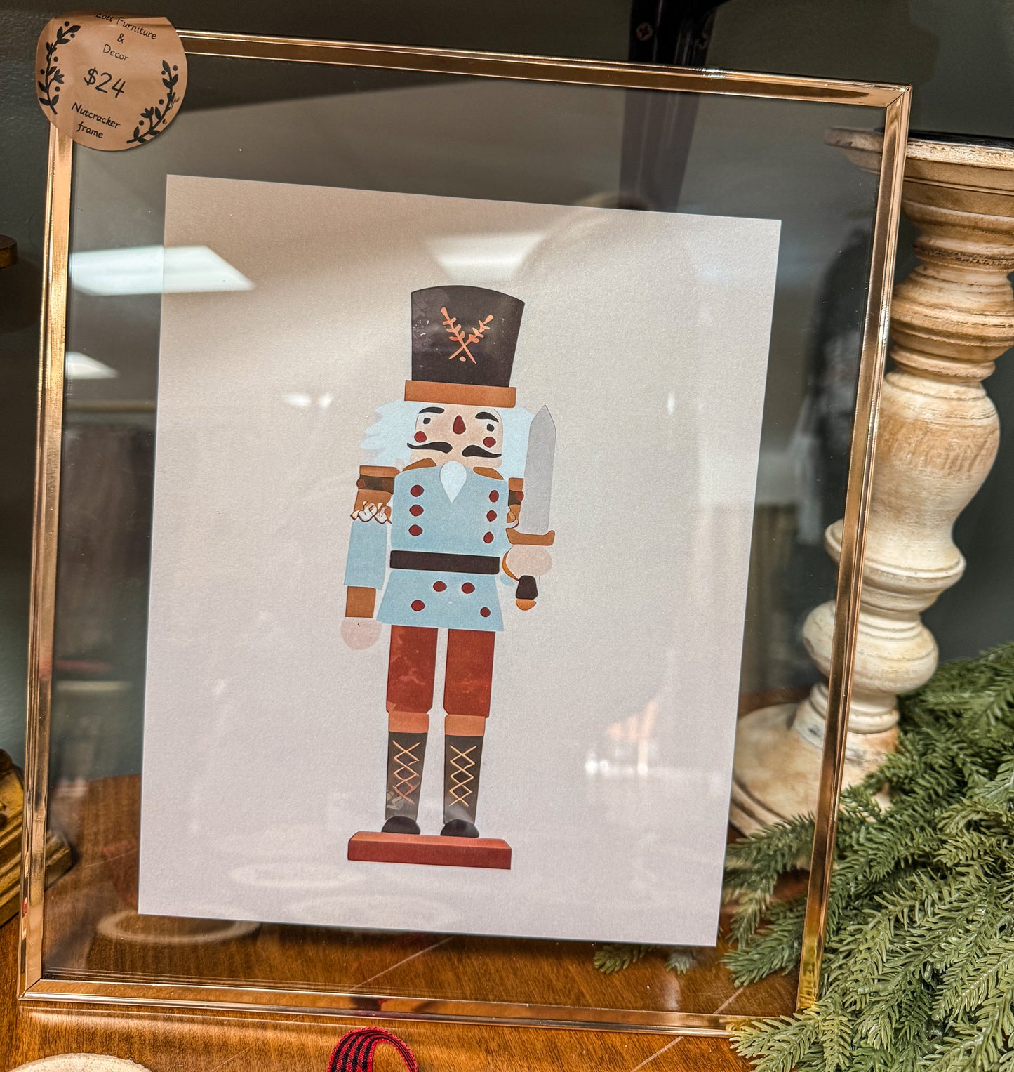 Nut cracker in gold frame
