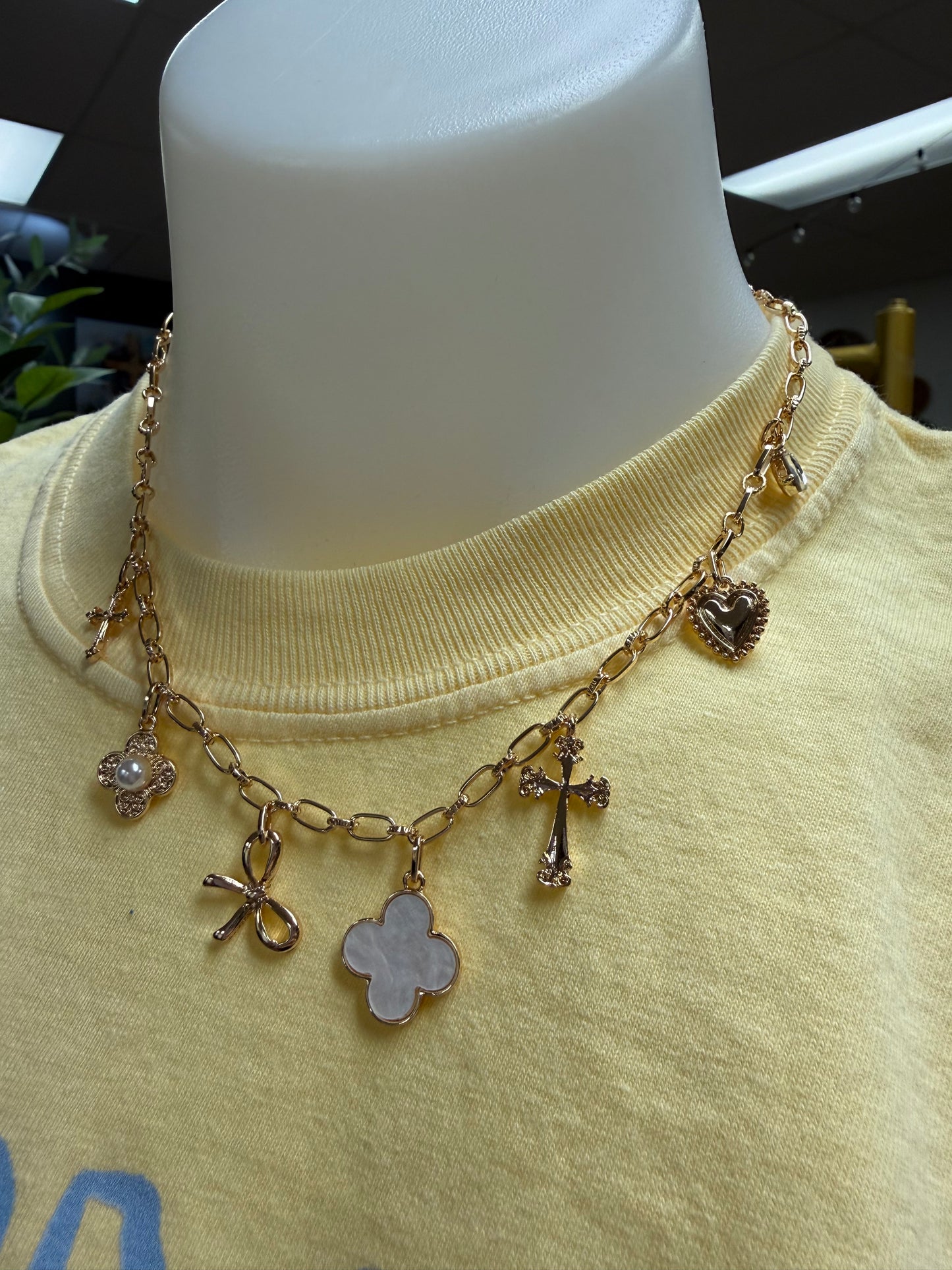Gold and white charm necklace
