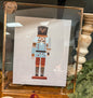 Nut cracker in gold frame