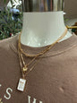 Triple layer white bow pendant necklace